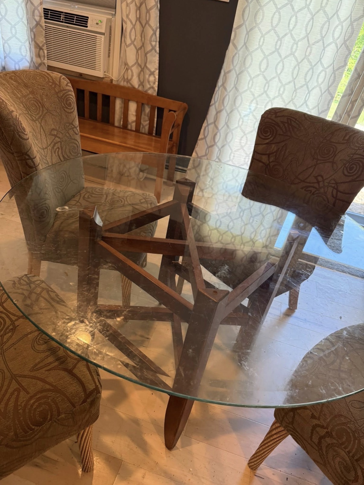 Smudged glass dining table before cleaning